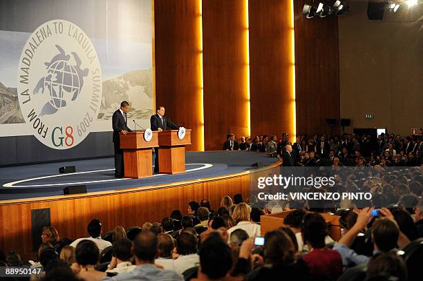 Italian Prime Minister Silvio Berlusconi and US President Barack Obama speak at the Group of Eight summit in L'Aquila, central Italy, on July 9,...