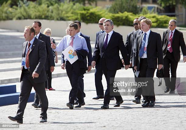 British Prime Minister Gordon Brown arrives for a workshop meeting between the G8 countries and the G5 emerging countries on the Major Economies and...