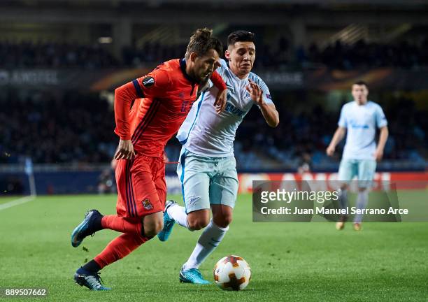 Matias Kranevitter of Zenit St. Petersburg duels for the ball with Adnan Januzaj of Real Sociedad during the UEFA Europa League group L football...