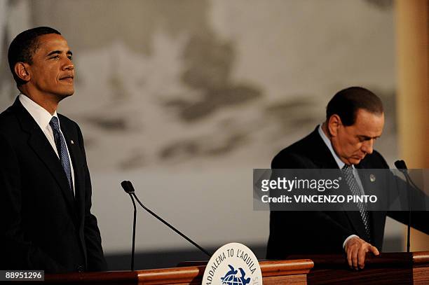 Italian Prime Minister Silvio Berlusconi introduces US President Barack Obama at the Group of Eight summit in L'Aquila, in central Italy, on July 9,...
