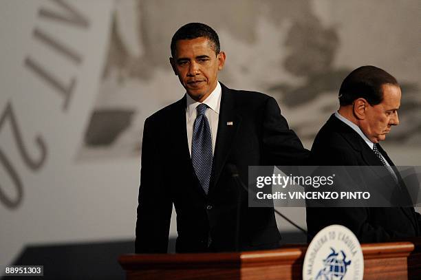 Italian Prime Minister Silvio Berlusconi introduces US President Barack Obama at the Group of Eight summit in L'Aquila, in central Italy, on July 9,...