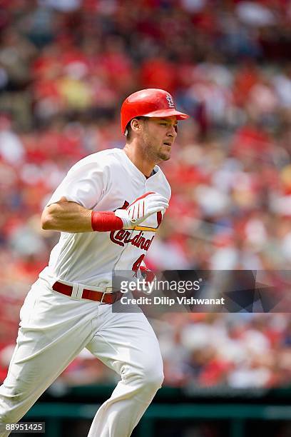 Ryan Ludwick of the St. Louis Cardinals runs to first base against the Colorado Rockies on June 8, 2009 at Busch Stadium in St. Louis, Missouri. The...