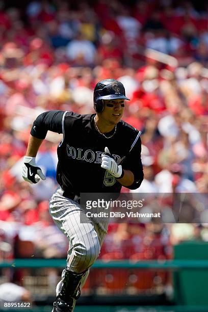 Carlos Gonzalez of the Colorado Rockies runs to first base against the St. Louis Cardinals on June 8, 2009 at Busch Stadium in St. Louis, Missouri....
