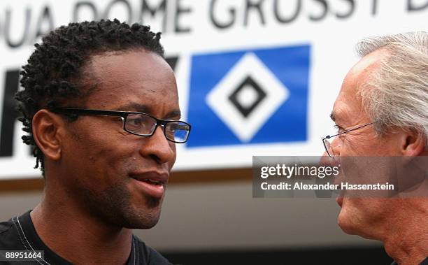 Hamburg's new player Ze Roberto talks to team manager Bernd Wehmeyer signs as he arrives at the team squad 'Aqua Dom' at day four of the Hamburger SV...