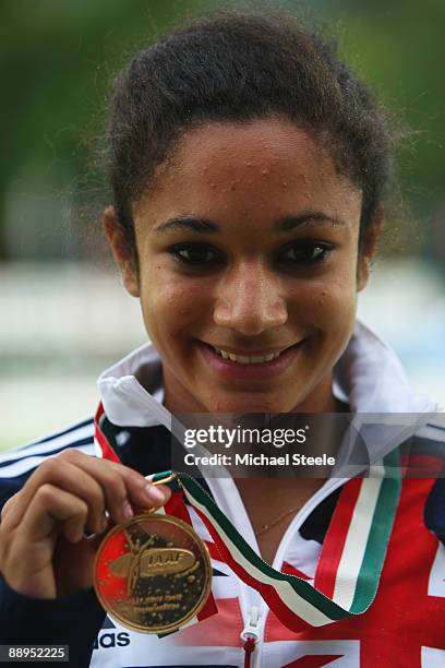 Jodie Williams of Great Britain shows off her gold medal after her victory in the girl's 100m final during day two of the IAAF World Youth...
