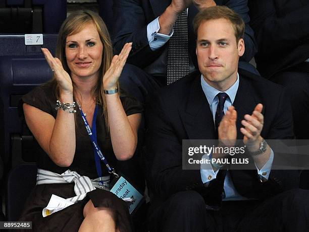 Britain's Prince William and former British water polo player Joanna Wray take their seats at The Manchester Aquatics Centre in Manchester,...