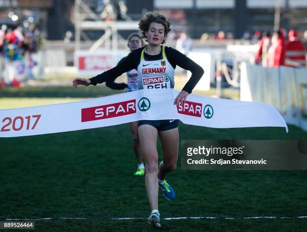 Alina Reh of Germany celebrates his first place during the U23 Womens race of SPAR European Cross Country Championships on December 10, 2017 in...