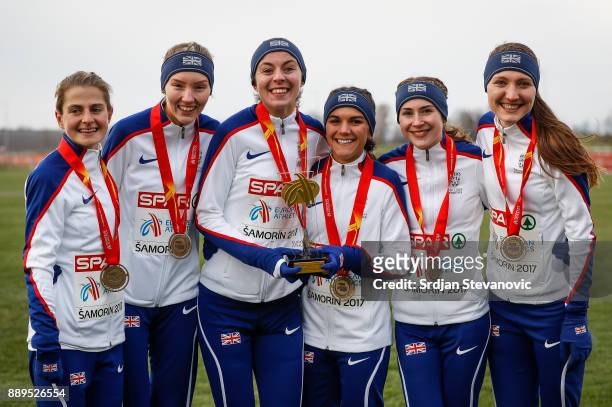 Great Britain team celebrate their Gold Medal during the U23 Women's award ceremony during the SPAR European Cross Country Championships on December...