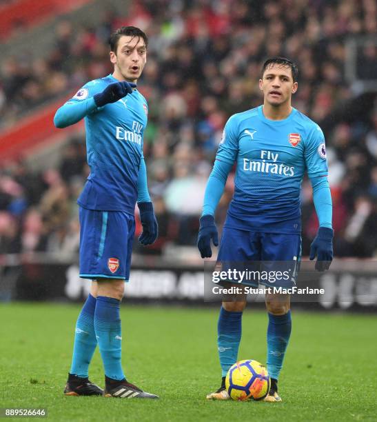 Mesut Ozil and Alexis Sanchez during the Premier League match between Southampton and Arsenal at St Mary's Stadium on December 10, 2017 in...