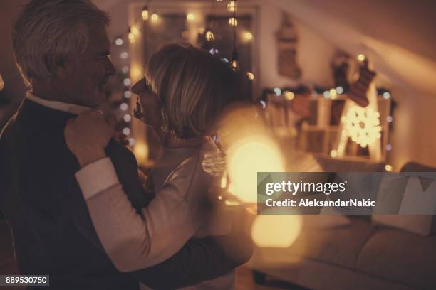 slow dance on new year's eve - old man woman christmas stock pictures, royalty-free photos & images