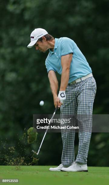 Aaron Baddeley of Australia plays a shot from the fairway during the first round of the John Deere Classic at TPC Deere Run held on July 9, 2009 in...