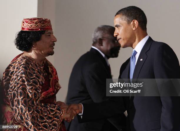 Libyan leader Muammar Gaddafi shakes hands with U.S. President Barack Obama during the G8 summit on July 9, 2009 in L'Aquila, Italy. The talks are...