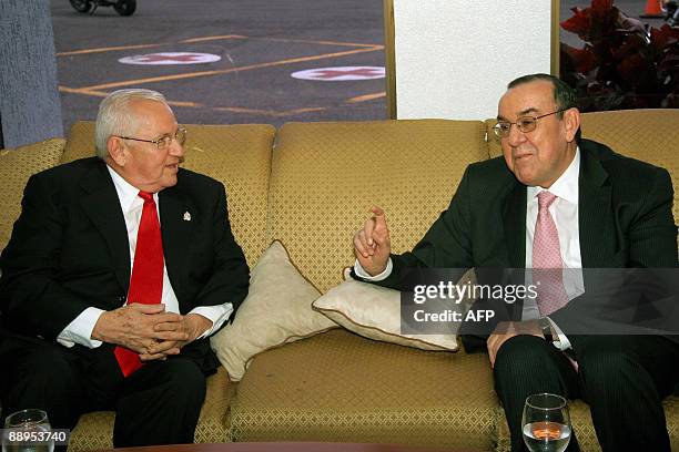Interim Honduran President Roberto Michelleti and Costa Rican Minister of the Presidency Rodrigo Arias talk at Juan Santamaria International Airport...