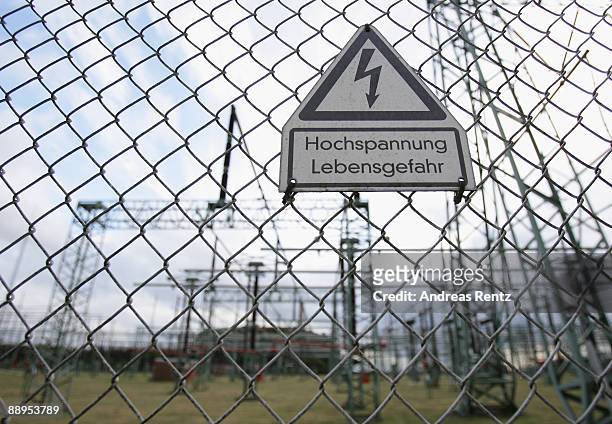 Sign indicates 'Danger - high voltage' near power lines of the Kruemmel nuclear power plant, operated by Swedish energy giant Vattenfall, on July 9,...
