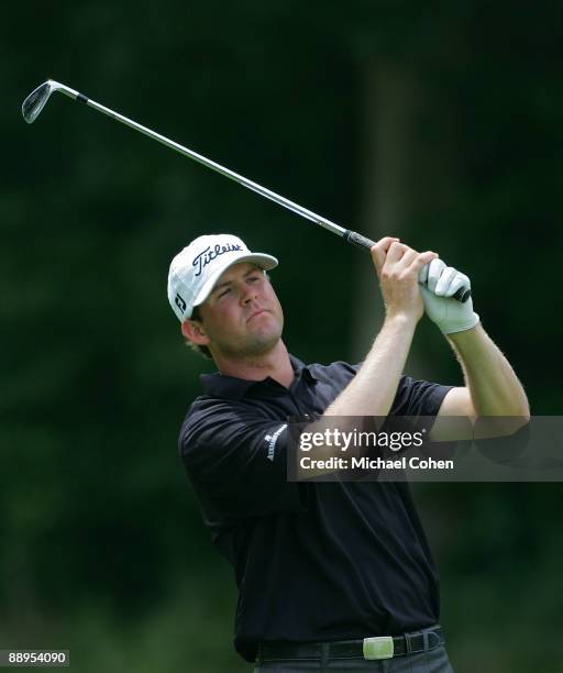 Trahan of the USA watches his shot during the first round of the John Deere Classic at TPC Deere Run held on July 9, 2009 in Silvis, Illinois.