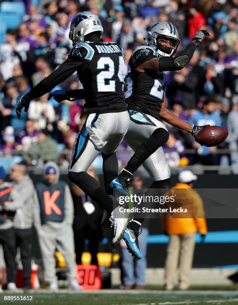 Daryl Worley celebrates with teammate James Bradberry of the Carolina Panthers after an interception against the Minnesota Vikings in the first...