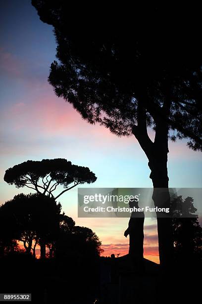 View of a statue at sunset at Villa Medici on July 9, 2009 in Rome, Italy. With nearly 3000 years of history Rome continues to live up to its motto...