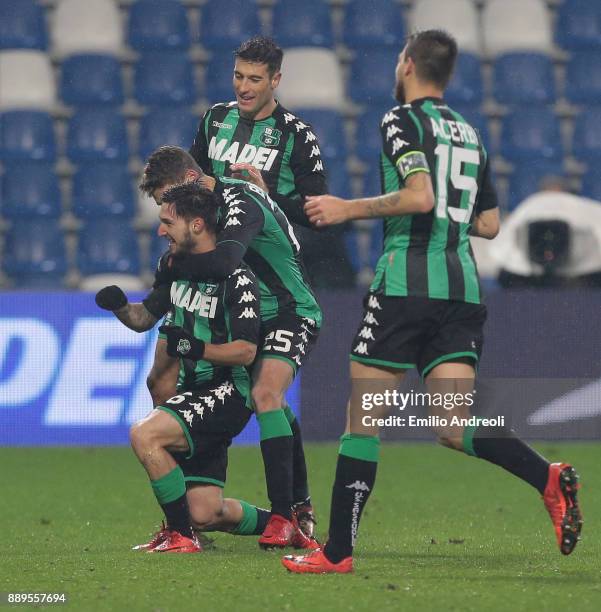 Matteo Politano of US Sassuolo Calcio celebrates his goal with his team-mate Domenico Berardi and Federico Peluso during the Serie A match between US...