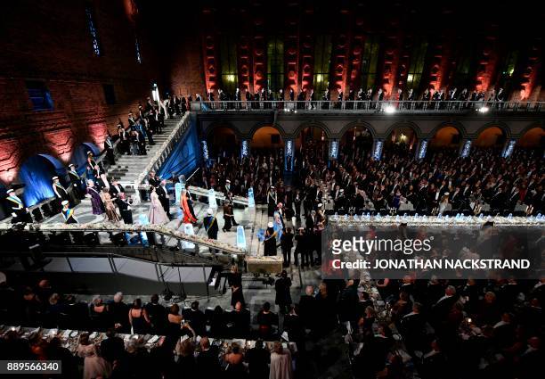 Guests and 2017 Nobel prize laureates arrive at the 2017 Nobel Banquet for the laureates in medicine, chemistry, physics, literature and economics in...