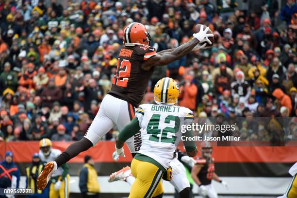 Josh Gordon of the Cleveland Browns makes a touchdown reception over Morgan Burnett of the Green Bay Packers in the first quarter at FirstEnergy...