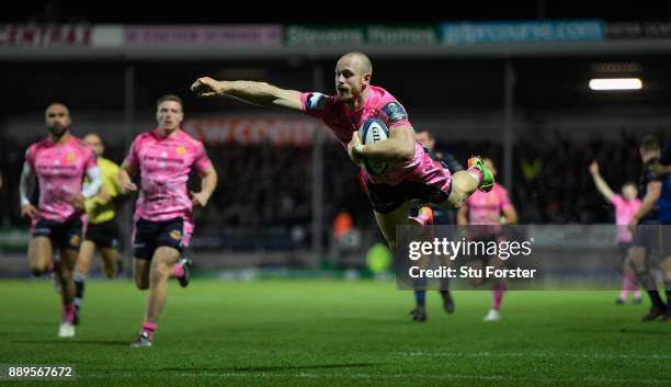 Chiefs wing Olly Woodburn dives over to score during the European Rugby Champions Cup match between Exeter Chiefs and Leinster Rugby at Sandy Park on...