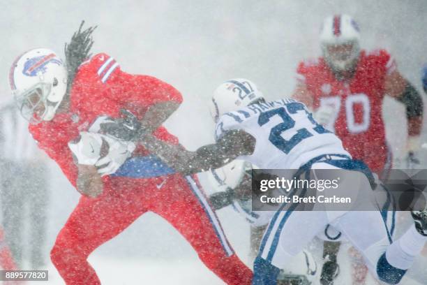 Kelvin Benjamin of the Buffalo Bills is tackled by Nate Hairston of the Indianapolis Colts during the first quarter on December 10, 2017 at New Era...