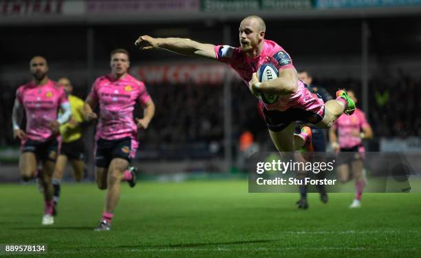 Chiefs wing Olly Woodburn dives over to score during the European Rugby Champions Cup match between Exeter Chiefs and Leinster Rugby at Sandy Park on...