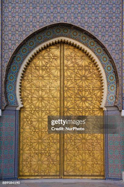 The entrance with the golden gates in the old Royal Palace in Fez, Morocco