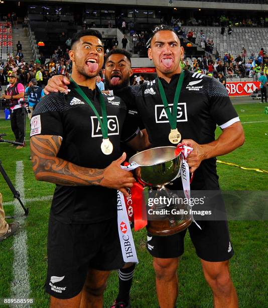 Regan Ware of New Zealand and Teddy Stanaway of New Zealand pose with trophy after the 2017 HSBC Cape Town Sevens Cup Final match between New Zealand...