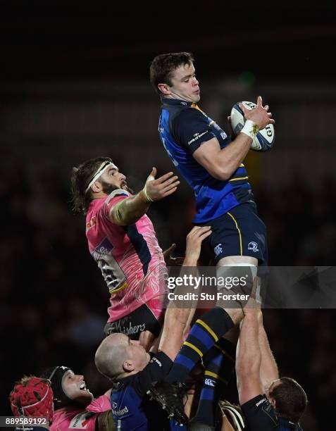 Leinster player James Ryan wins a lineout ball despite the attentions of Don Armand during the European Rugby Champions Cup match between Exeter...
