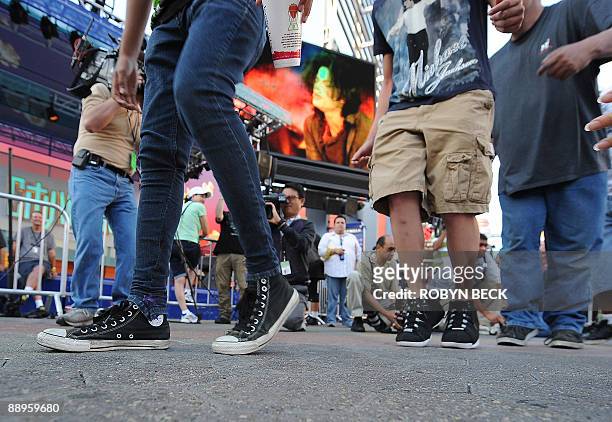 Fans participate in a moonwalk contest at a one-day tribute to the "King of Pop" which included outdoor screenings of "The Wiz" and "Thriller," at...