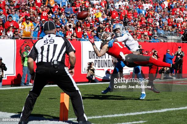 Teez Tabor of the Detroit Lions defends a pass in the end zone against Mike Evans of the Tampa Bay Buccaneers in the first quarter of a game against...
