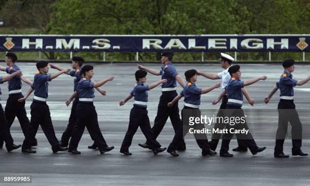 Royal Navy recruits practice their marching for their passing out parade at the training establishment HMS Raleigh on the final day of their initial...