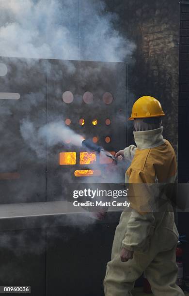 Royal Navy recruits learn fire fighting techniques during a exercise at the training establishment HMS Raleigh during the final week of their initial...