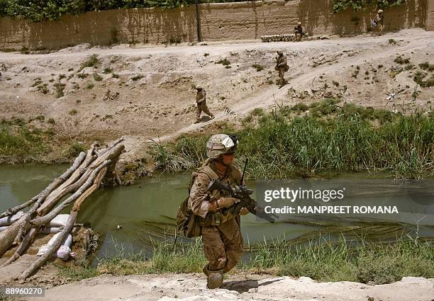 In this picture taken July 8 US Marine Gunnery Sergeant Jerry Eagle Junior of 1st Combat Engineering Battalion of 2nd Marine Expeditionary Brigade...