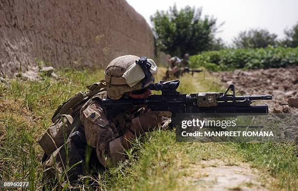 In this picture taken July 8 US Marine Gunnery Sergeant Jerry Eagle Junior of 1st Combat Engineering Battalion of 2nd Marine Expeditionary Brigade...