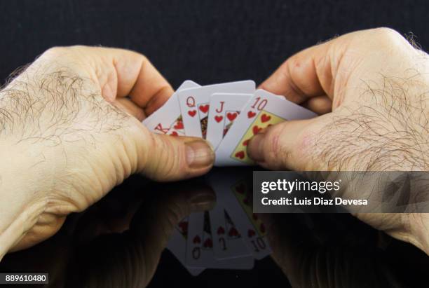 more and more people are using their mobile phones to play poker - royal flush stock pictures, royalty-free photos & images