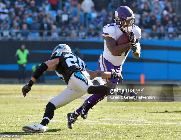 Jerick McKinnon of the Minnesota Vikings cuts back against Kurt Coleman of the Carolina Panthers during their game at Bank of America Stadium on...