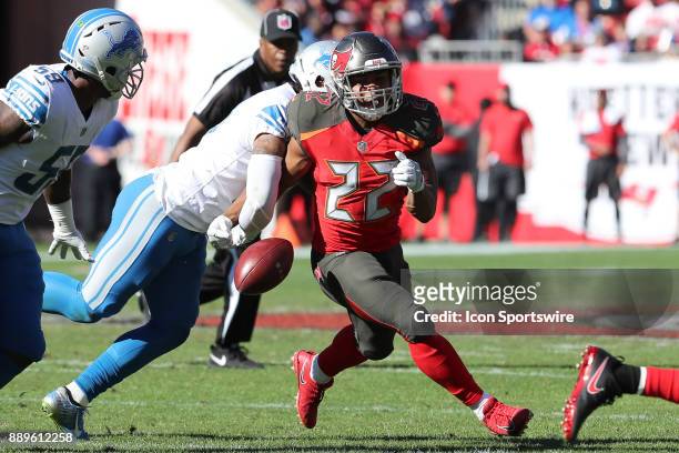 Detroit Lions free safety Glover Quin forces Tampa Bay Buccaneers running back Doug Martin to fumble the ball in the second quarter of the NFL game...