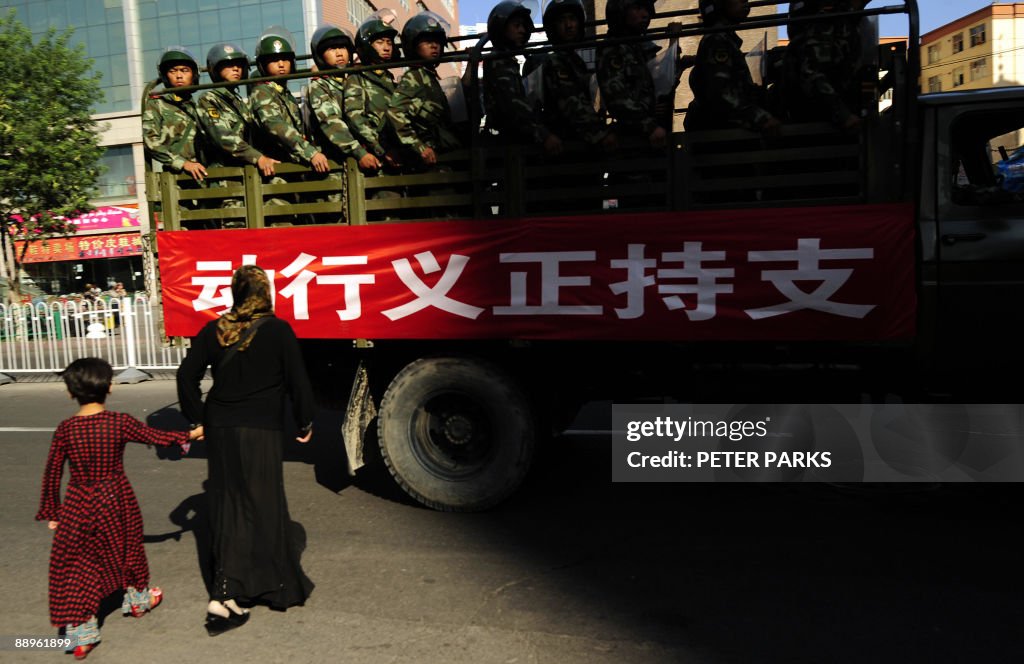 A Muslim ethnic Uighur woman and her dau