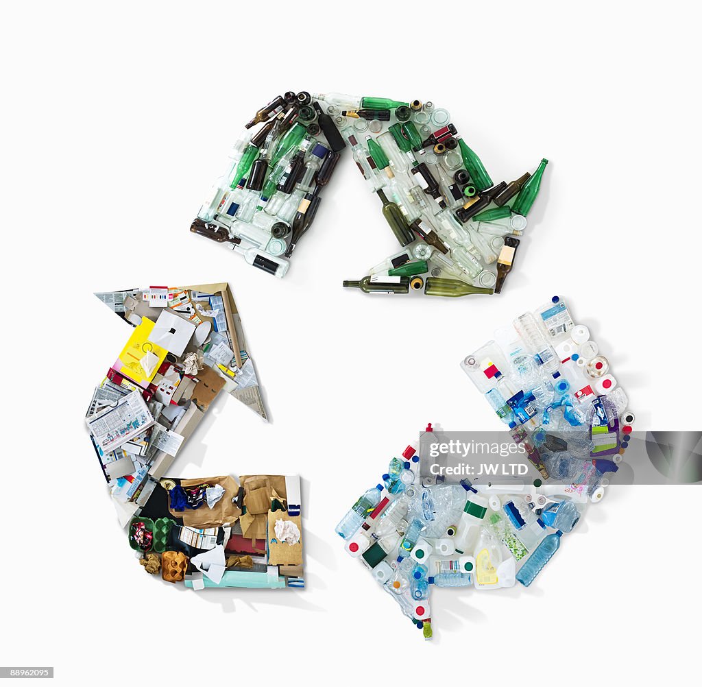 Recycling materials in shape of recycling symbol