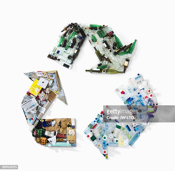 recycling materials in shape of recycling symbol - glass material stock pictures, royalty-free photos & images