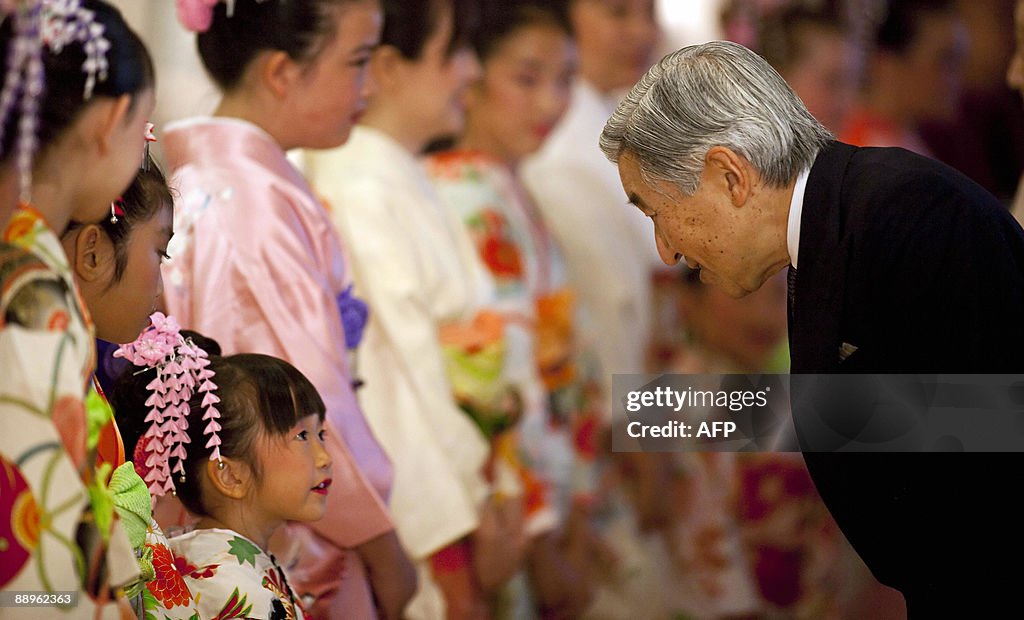 Emperor Akihito of Japan is greeted by a