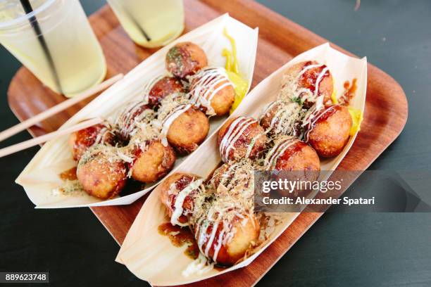 close-up of takoyaki octopus dumpling balls - präfektur osaka stock-fotos und bilder