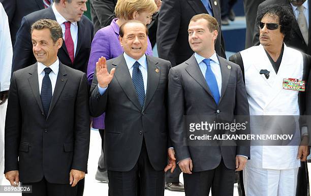 French President Nicolas Sarkozy, Italian Prime Minister Silvio Berlusconi, Russian President Dmitri Medvedev and Libyan Leader Moamer Kadhafi are...