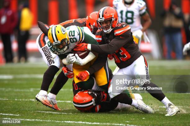 Richard Rodgers of the Green Bay Packers is tackled by Joe Schobert of the Cleveland Browns in the second quarter at FirstEnergy Stadium on December...