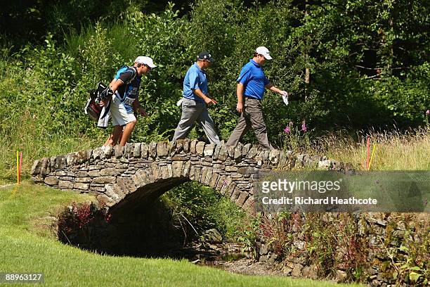 Marcus Fraser and Peter O'Malley of Australia cross a bridge on the 16th hole during the Second Round of The Barclays Scottish Open at Loch Lomond...