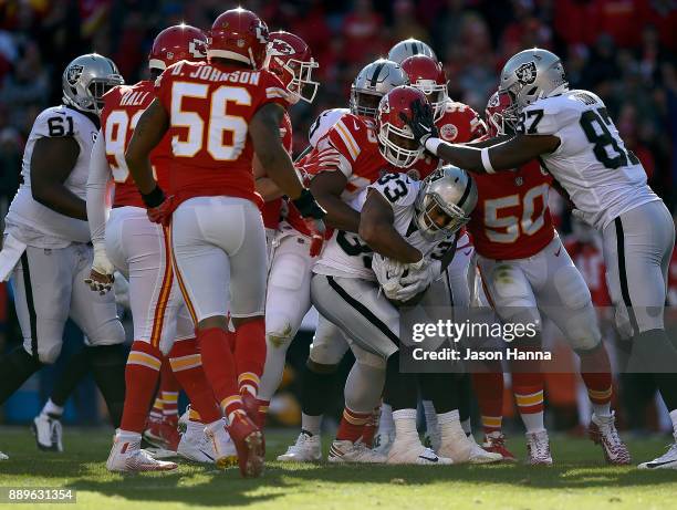 Running back DeAndre Washington of the Oakland Raiders carries the ball during the game against the Kansas City Chiefs at Arrowhead Stadium on...