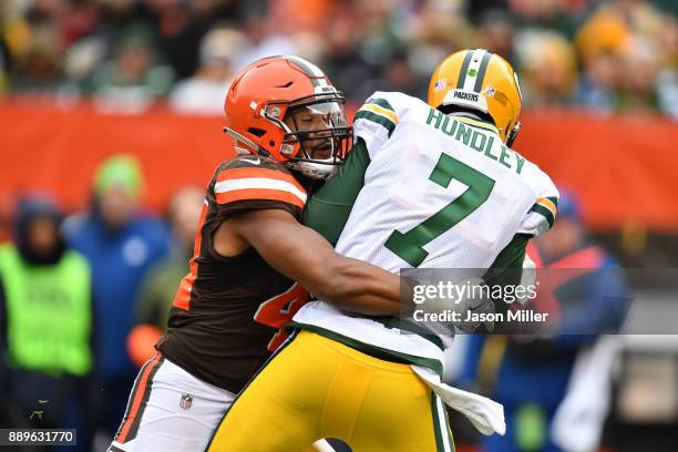 Brett Hundley of the Green Bay Packers is sacked by Nate Orchard of the Cleveland Browns in the second quarter at FirstEnergy Stadium on December 10,...