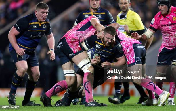 Leinster's Sean O'Brien is tackled by Exeter's Jonny Hill and Jack Yeandle during the European Rugby Champions Cup, Pool Three match at Sandy park,...